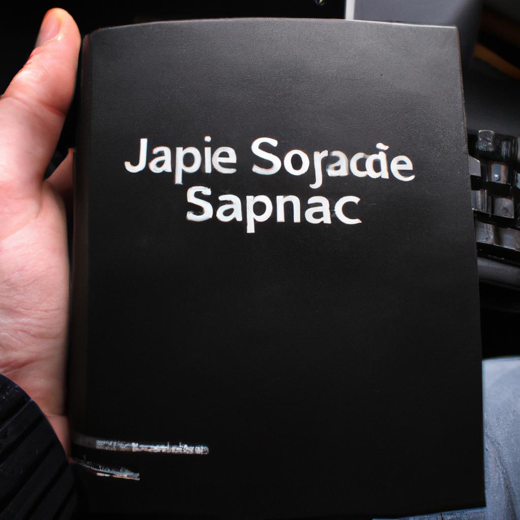 Person holding JavaScript code book